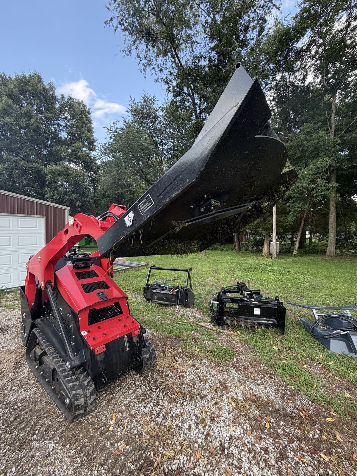 Stand-on skid steer with attachments